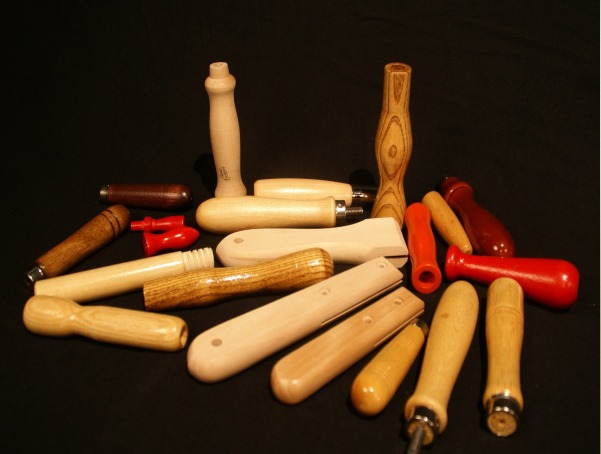 Assorted small wooden handles with various secondary operations and custom finishes, available in bulk for large-scale production.